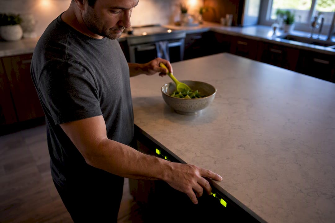 Parent checking sports display in kitchen