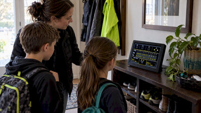 Family checking one LiveWire sports scoreboard